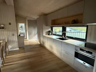 a kitchen with a sink and a counter top at Holiday Home Glenda - 3km from the sea by Interhome in Saltum