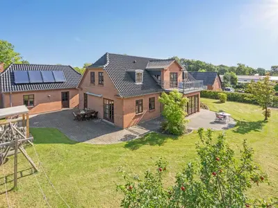 an aerial view of a house with a yard at Holiday Home Iarund - 500m to the fjord by Interhome in Løgstør