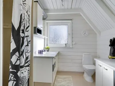 a small bathroom with a toilet and a window at Holiday Home Aranja - 300m to the fjord by Interhome in Løgstør