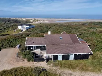 an aerial view of a house on the beach at Holiday Home Rauli - 50m from the sea by Interhome in Saltum