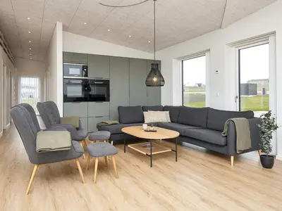 a living room with a couch and chairs and a table at 12 person holiday home in Lemvig-By Traum in Lemvig