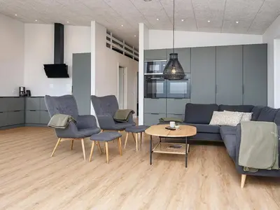 a living room with a couch and chairs and a table at 12 person holiday home in Lemvig-By Traum in Lemvig