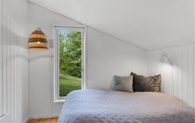 a white bedroom with a bed and a window at Awesome Home In Spøttrup With Wifi in Spottrup