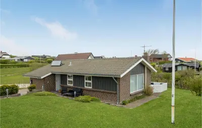 a house in a suburb with a yard at 2 Bedroom Cozy Home In Lemvig in Lemvig