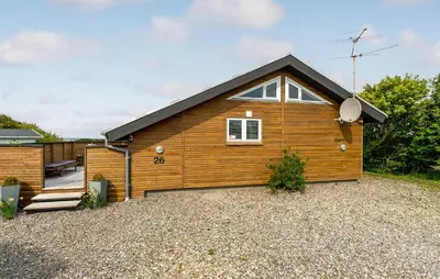 a small wooden house with a gravel yard at Stunning Home In Vestervig With Sauna in Vestervig