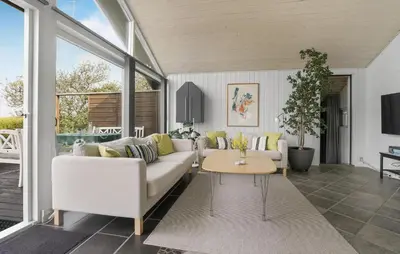 a living room with a white couch and a table at Stunning Home In Vestervig With Sauna in Vestervig