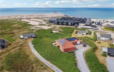 an aerial view of a model house next to the beach at 4 Bedroom Stunning Home In Thisted in Thisted